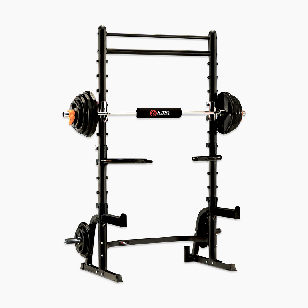 Black weightlifting power rack with barbell on a white background