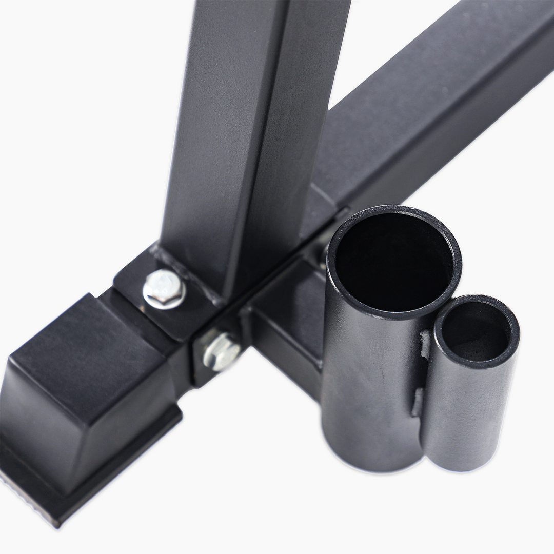 Close-up of a black metal bracket with cylindrical components on a white background