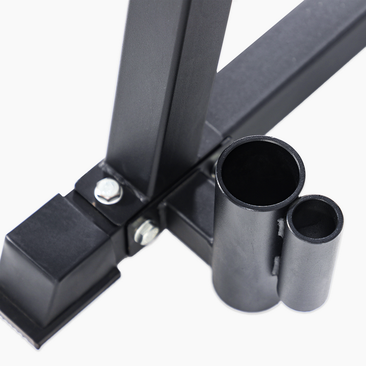 Close-up of a black metal bracket with cylindrical components on a white background