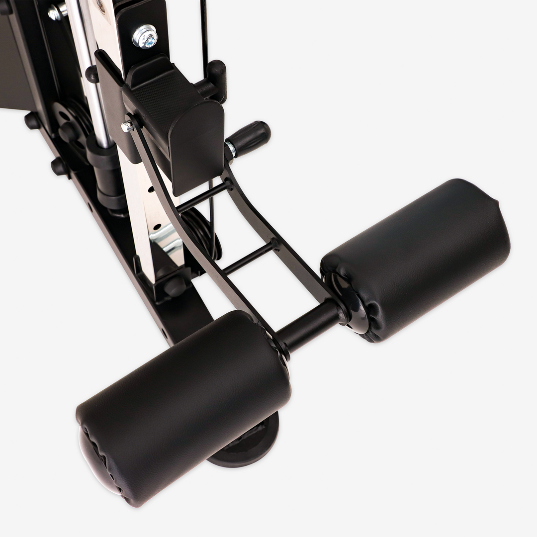 Close-up of a black gym machine component on a white background