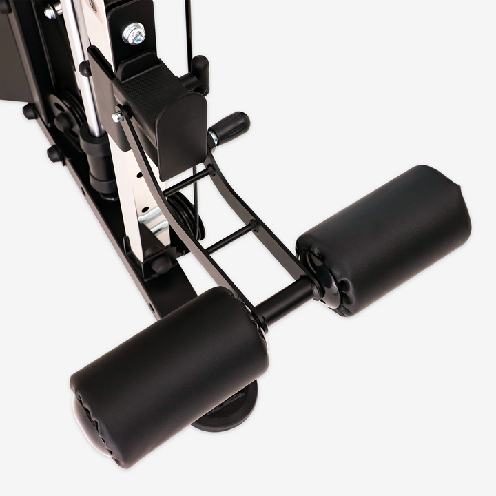Close-up of a black gym machine component on a white background