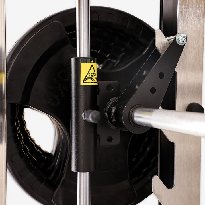 Close-up of a mechanical component with a warning label on a white background