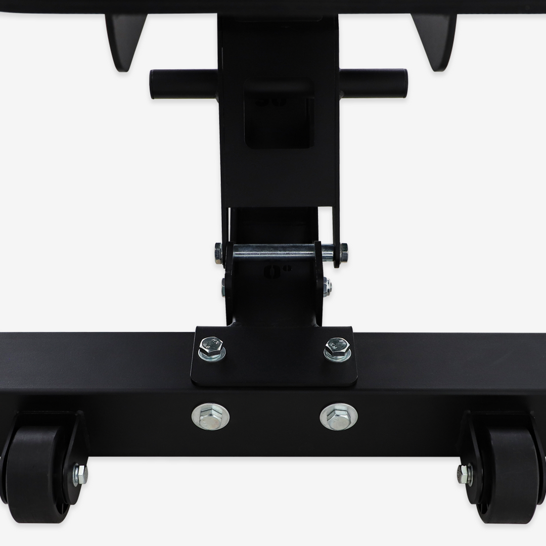 Close-up of a black metal bracket with wheels on a white background