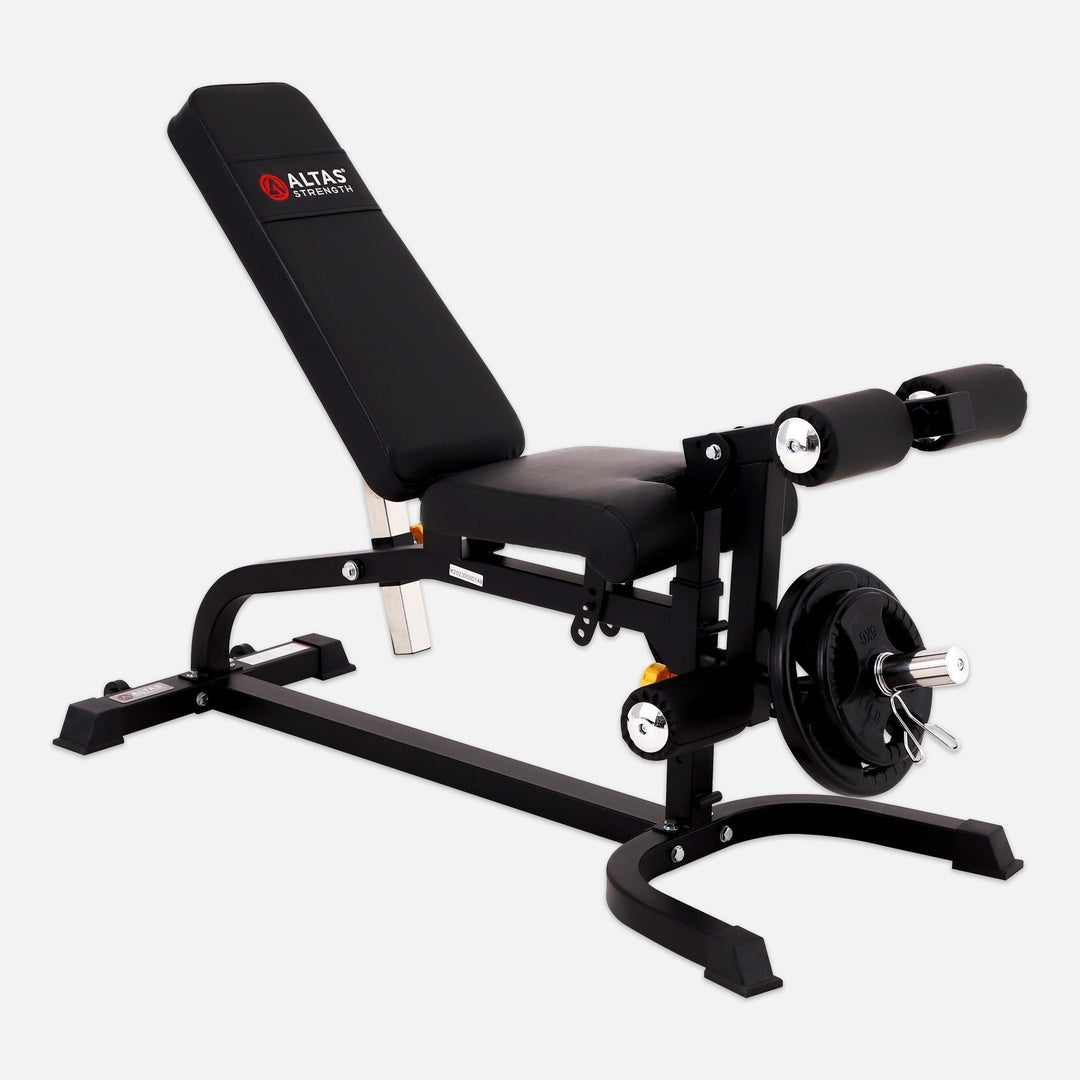 Black weight bench with adjustable backrest and weight plates on a white background