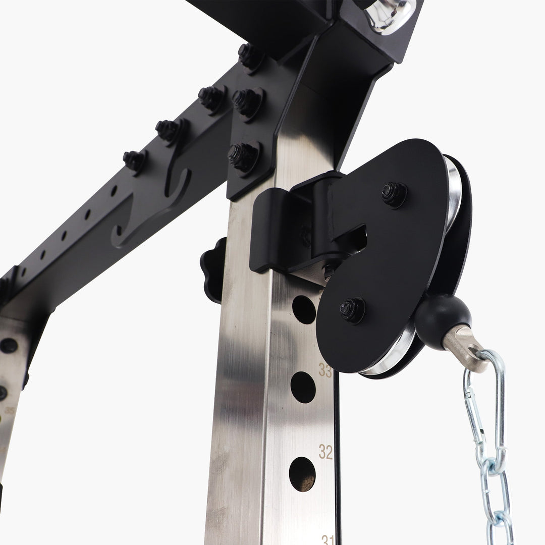 Close-up of a mechanical pulley system on a white background