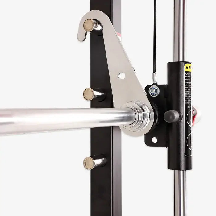 Close-up of ALTAS AL-3058G Smith machine barbell and pulley system for home gym strength training.
