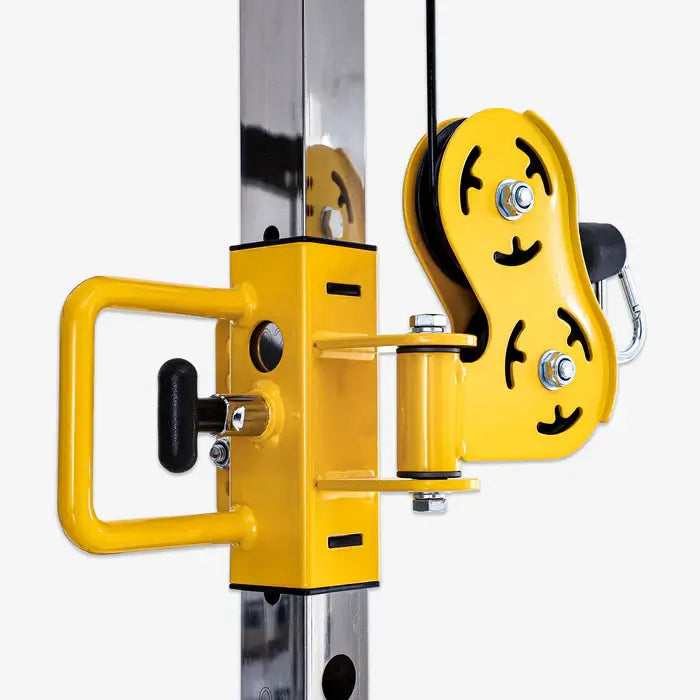 Close-up of the Altas AL-3059 Smith Machine pulley system, showcasing its durable yellow design and heavy-duty construction.