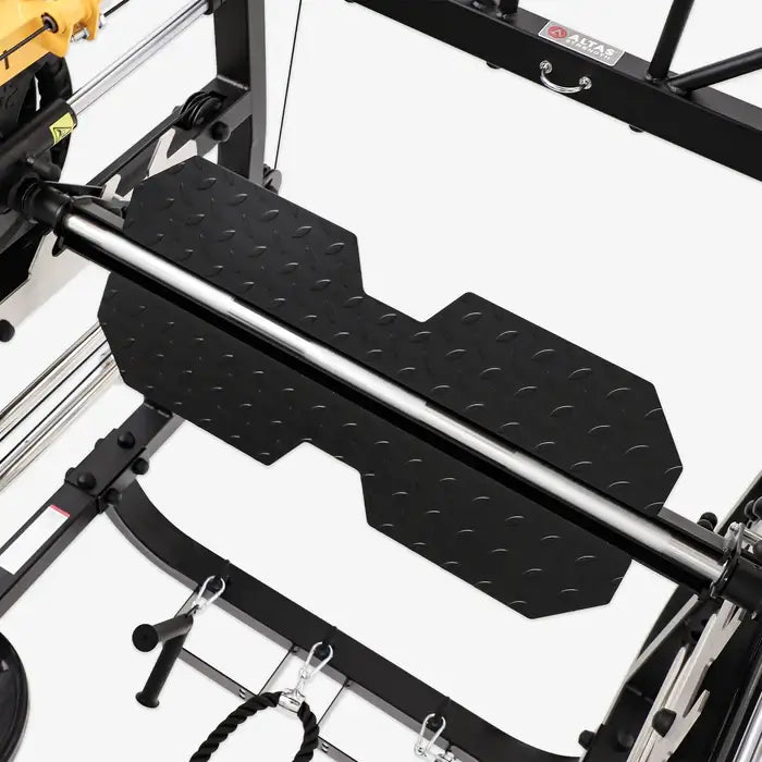 Close-up view of the Altas AL-M810 Smith Machine's solid weight platform for leg press training.