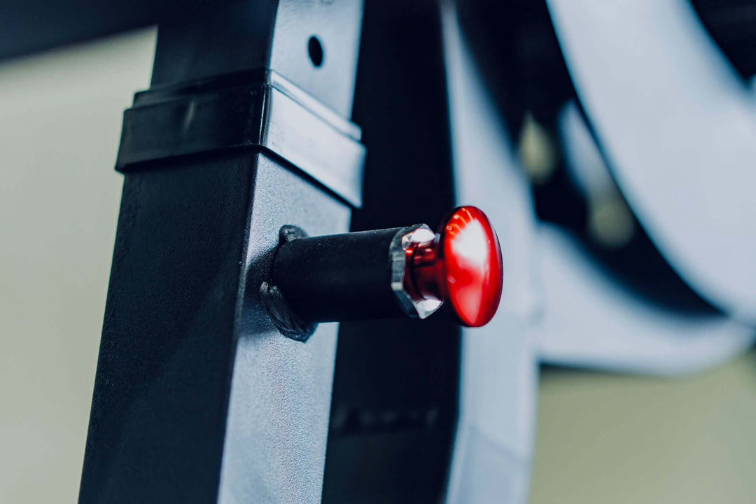 Close-up of the red adjustment knob on the heavy-duty adjustable bench XRAB03 for easy repositioning during workouts.