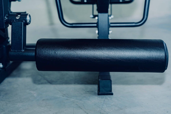 Close-up of padded roller on the X-RIVAL XB05 Leg Extension Machine for effective leg workouts.