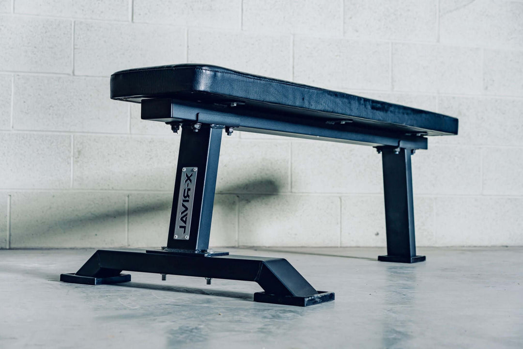 X-RIVAL Flat Bench Press designed for strength training, featuring a durable black frame for stability in workouts.