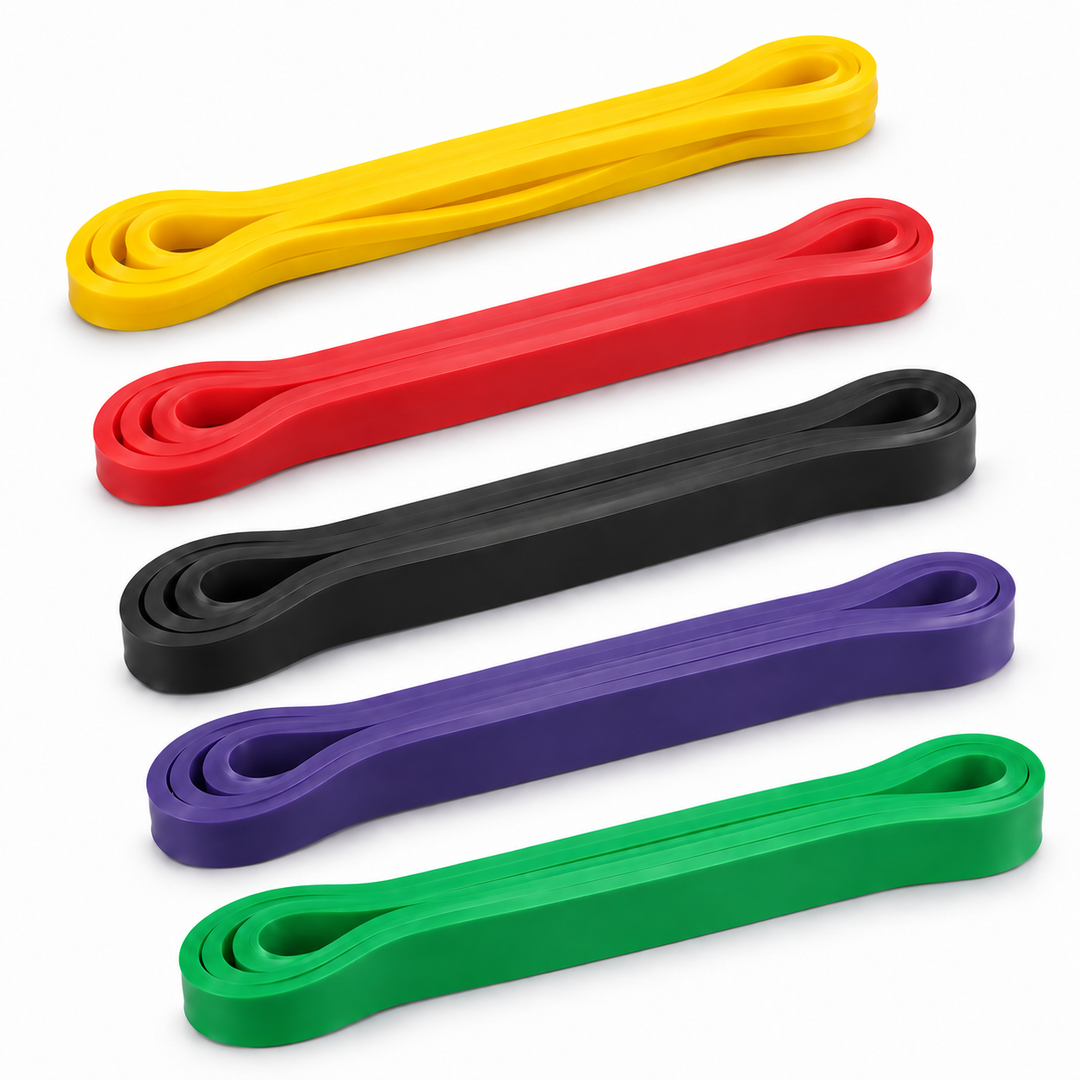 X-RIVAL long resistance band set with five loop bands, ordered yellow, red, black, purple and green, on a white background.